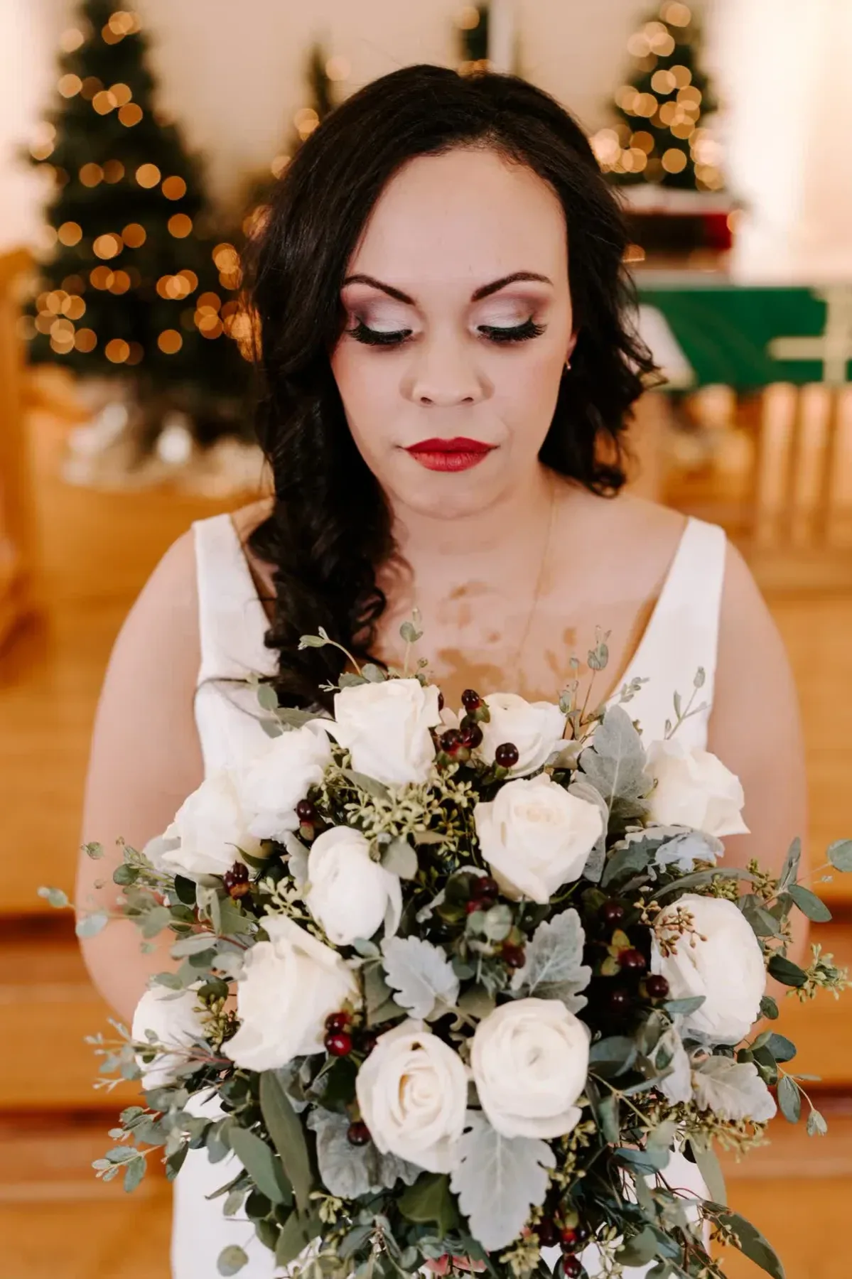 Bride holding a white rose bouquet