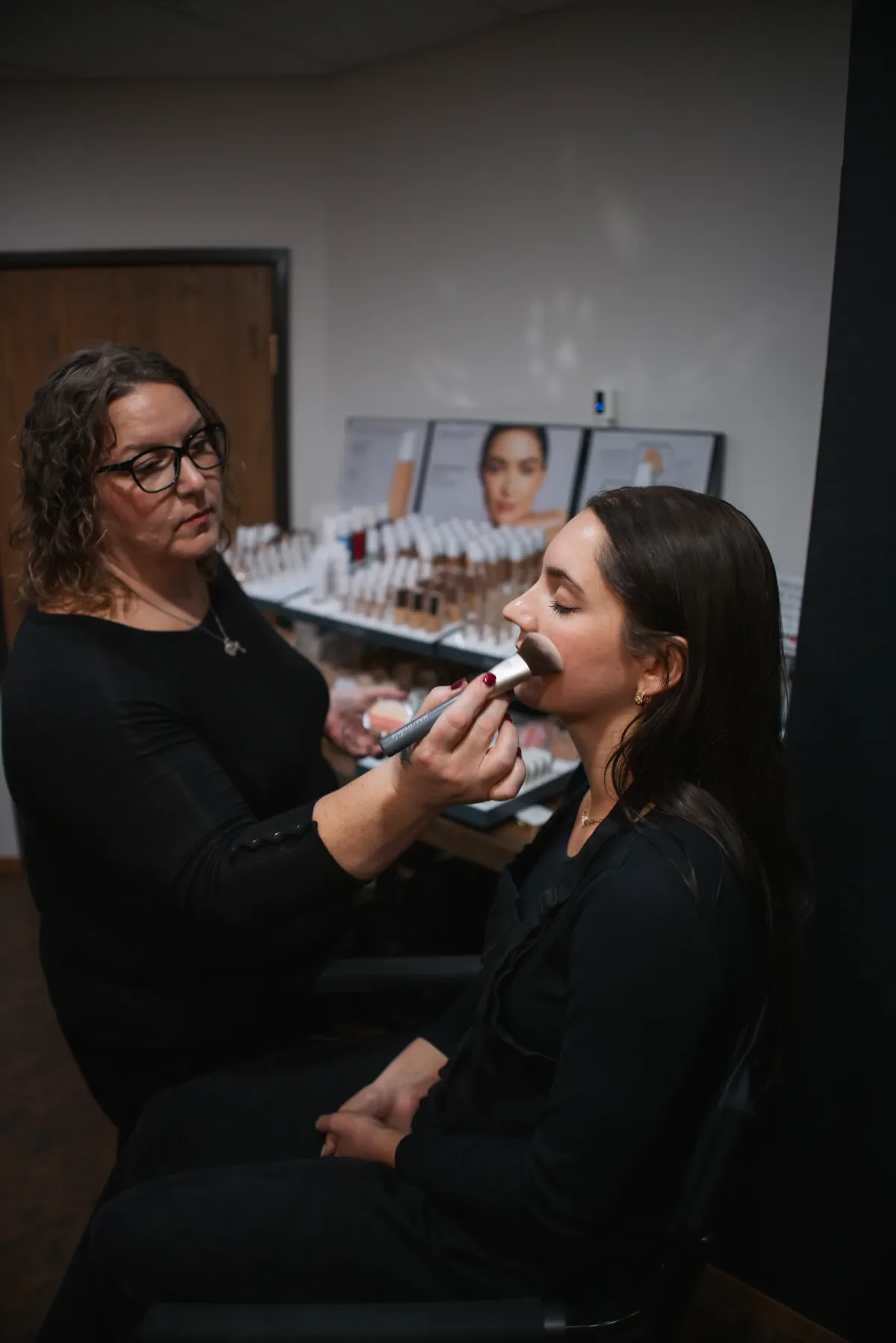 Makeup being applied at Evolution of Beauty in Marshall, Minnesota